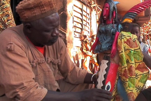Yaya Coulibaly making a puppet